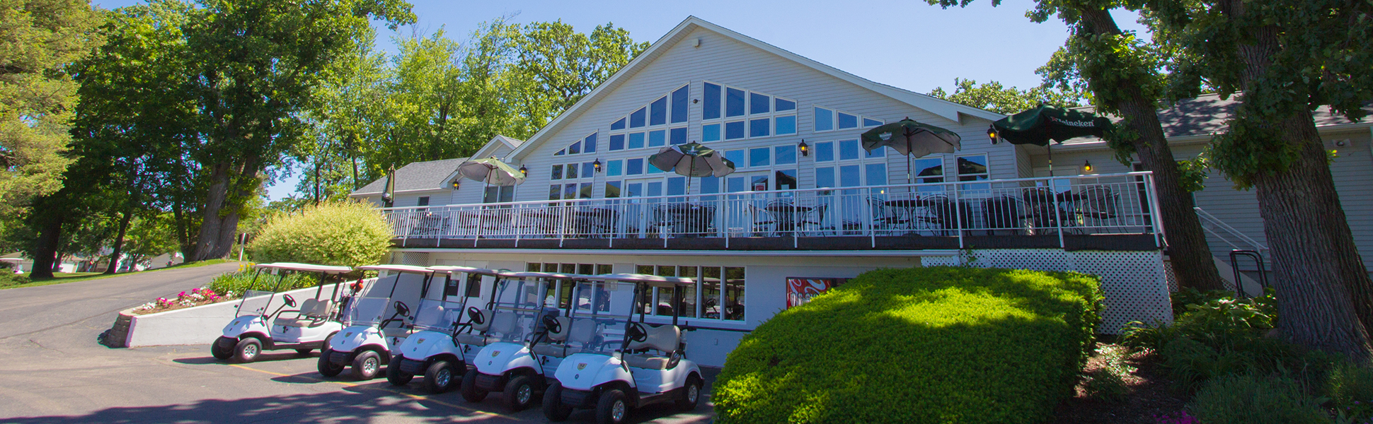 Clubhouse with row of golf carts